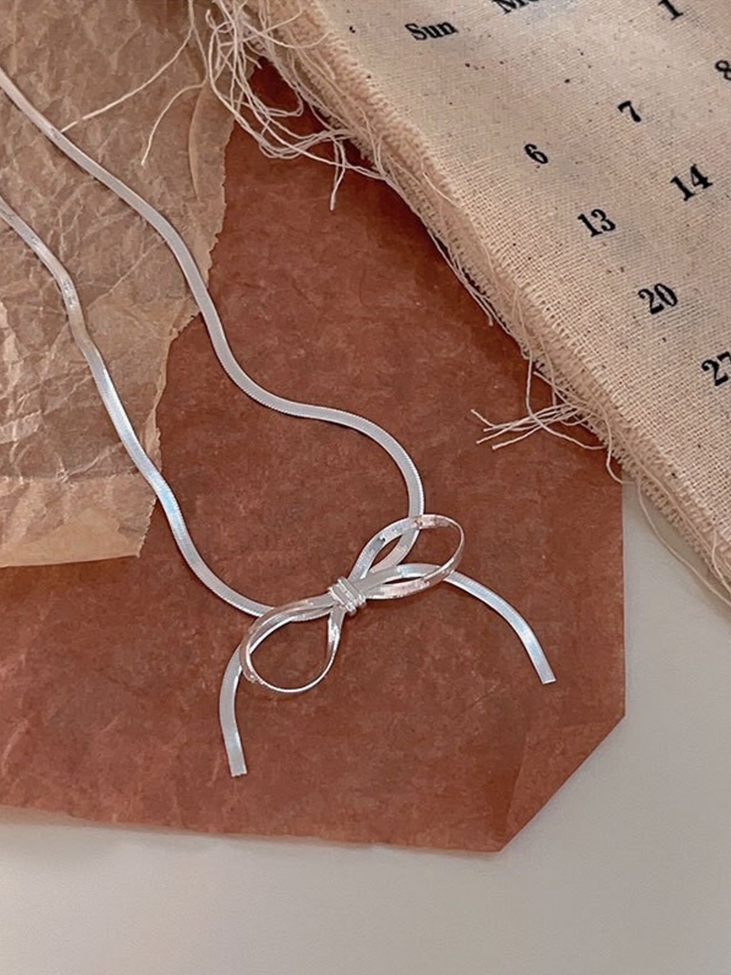 BLADE BOW NECKLACE