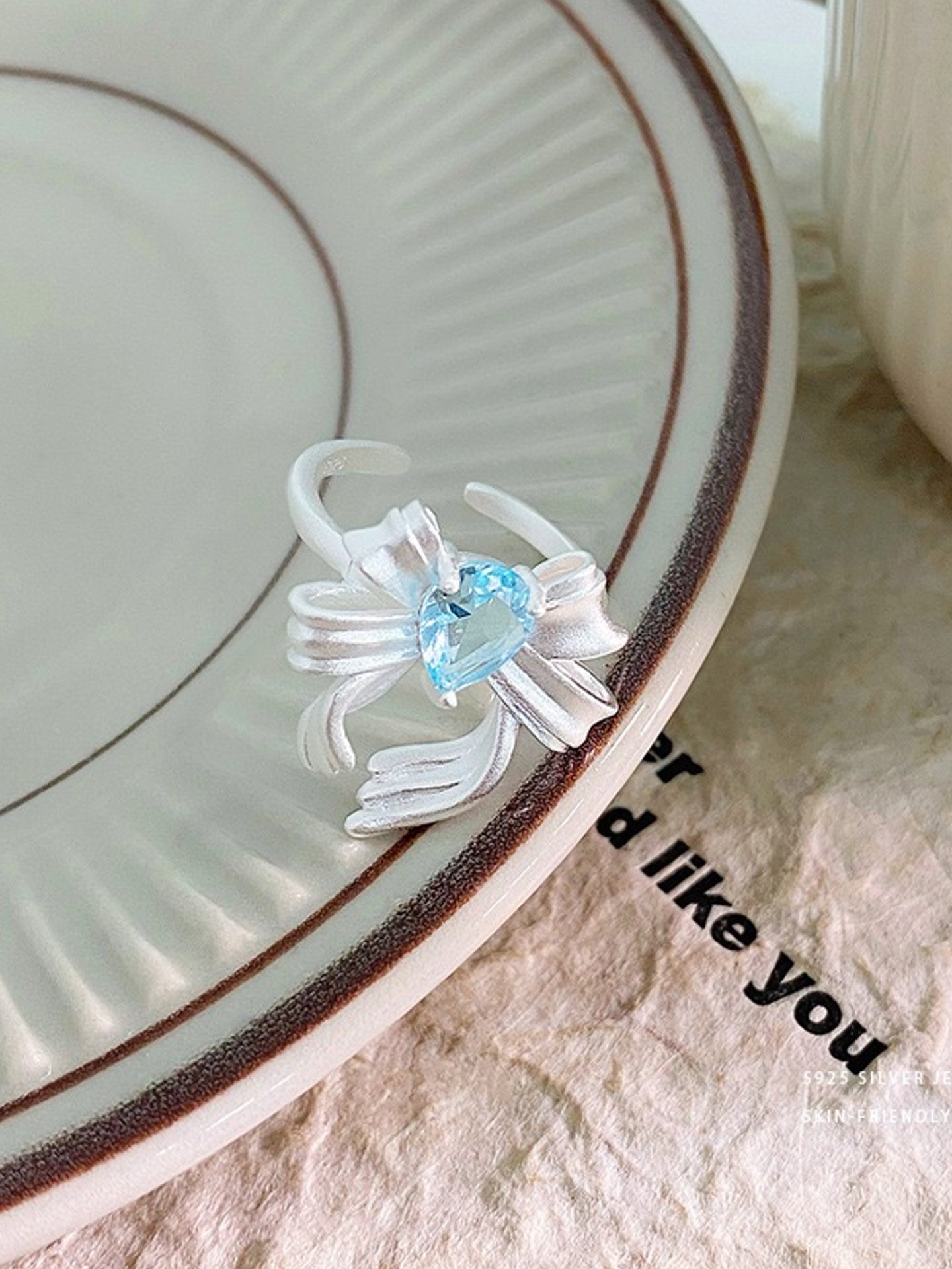 BLUE ZIRCON BOW RING