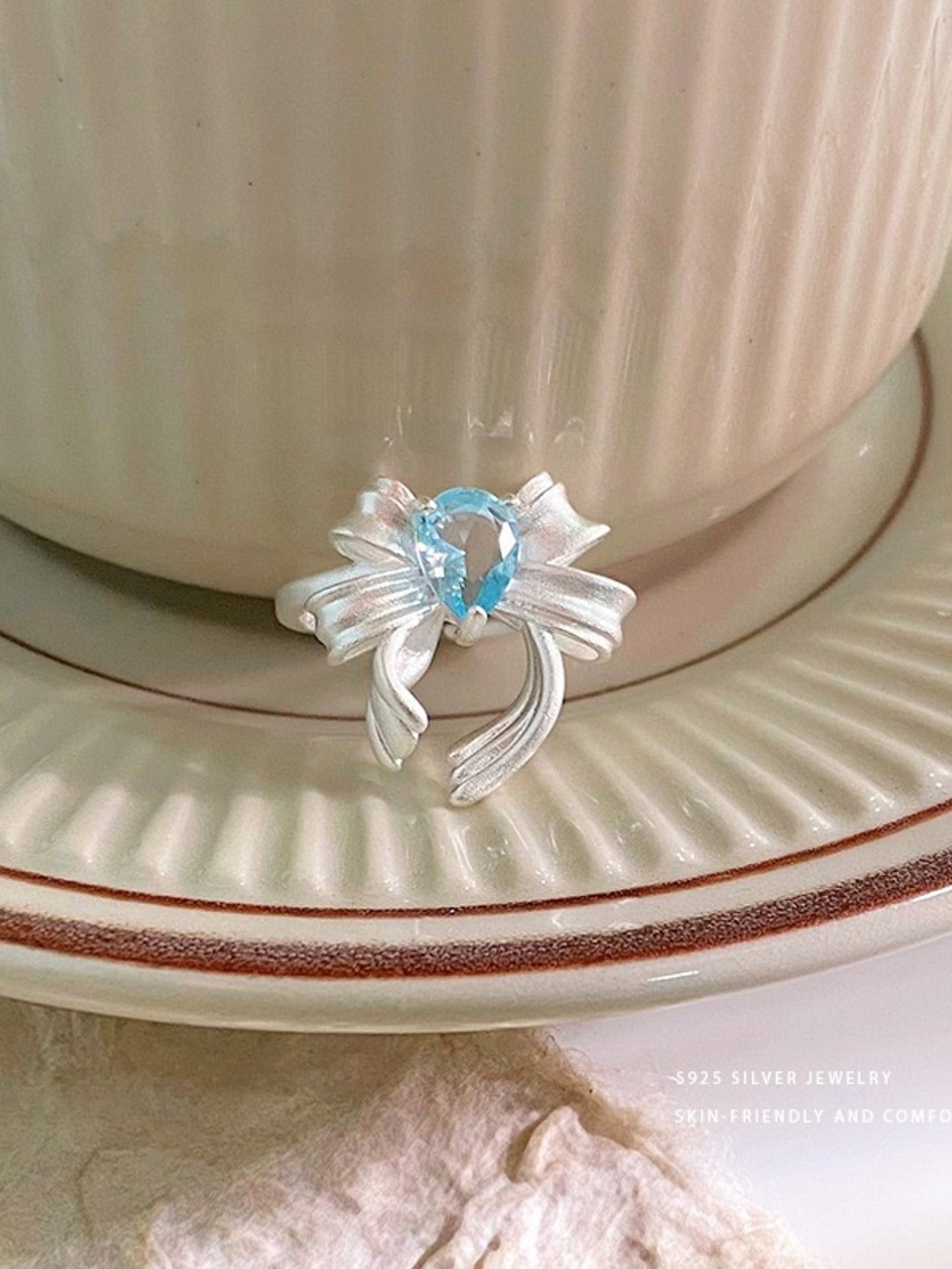 BLUE ZIRCON BOW RING