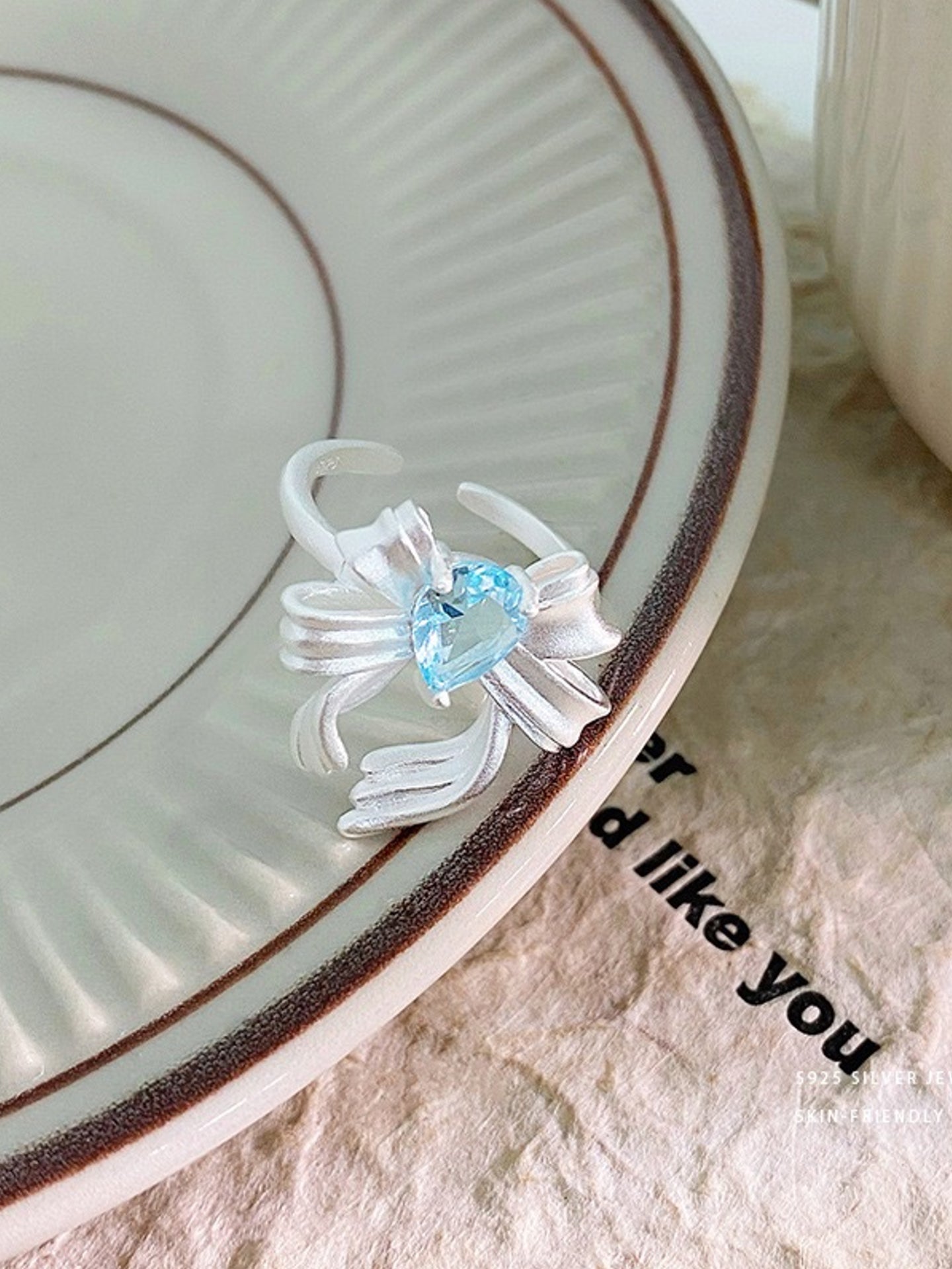 BLUE ZIRCON BOW RING