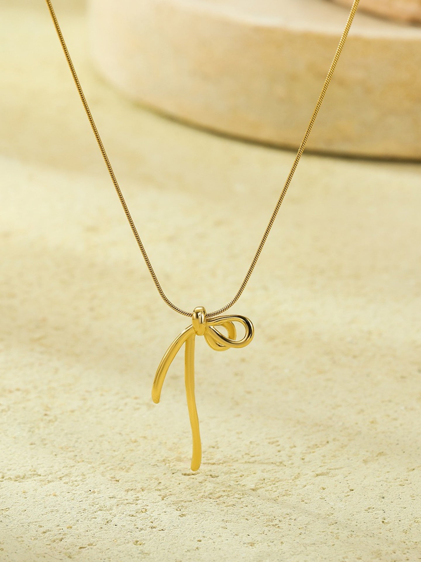 MINIMALIST BOW NECKLACE